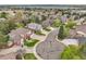 Aerial view of a neighborhood featuring beautiful homes, mature trees, and a view of the lake at 4220 S Yarrow Ct, Lakewood, CO 80235