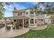 Spacious backyard with patio, covered seating area, and outdoor cooking area at 4220 S Yarrow Ct, Lakewood, CO 80235