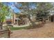 Large backyard with patio, lounge furniture, and well-maintained landscaping at 4220 S Yarrow Ct, Lakewood, CO 80235