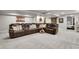 Basement entertainment area with comfortable seating, built-in features, and ample room for relaxing at 4220 S Yarrow Ct, Lakewood, CO 80235