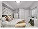 Bright bedroom featuring neutral tones, ample closet space, and a window seat for reading at 4220 S Yarrow Ct, Lakewood, CO 80235