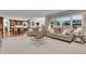 Bright living room showcases an open floor plan leading into a modern kitchen with an island at 4220 S Yarrow Ct, Lakewood, CO 80235