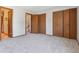 Spacious bedroom features three large closets and neutral carpeting at 7474 E Arkansas Ave # 17-07, Denver, CO 80231