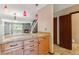 Inviting kitchen showcasing granite countertops, wooden cabinets, and a view into the adjacent living room at 7474 E Arkansas Ave # 17-07, Denver, CO 80231