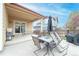 Relax in the backyard featuring a covered patio with dining and seating furniture at 9844 Norfolk St, Commerce City, CO 80022