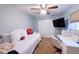 This bedroom features ample natural light, carpet flooring, and a ceiling fan at 9844 Norfolk St, Commerce City, CO 80022