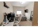 Bedroom featuring a TV, desk, and mirror at 9844 Norfolk St, Commerce City, CO 80022