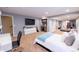This bedroom features lots of space, recessed lighting, a wet bar, and walk-in closet at 9844 Norfolk St, Commerce City, CO 80022
