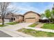 Beautifully maintained home with a two-car garage, manicured lawn, and welcoming curb appeal at 9844 Norfolk St, Commerce City, CO 80022