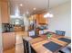 Bright kitchen with stainless steel appliances, granite countertops, and ample cabinet space at 9844 Norfolk St, Commerce City, CO 80022