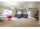 Inviting living room with vaulted ceilings, natural light, and comfortable seating at 9844 Norfolk St, Commerce City, CO 80022