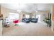 Open-concept living room with vaulted ceilings, lots of natural light, and a comfortable seating area at 9844 Norfolk St, Commerce City, CO 80022