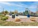 Community playground featuring slides, climbing equipment, park benches, and picnic tables at 9844 Norfolk St, Commerce City, CO 80022