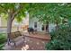 Backyard deck area with a grill and patio seating, perfect for outdoor dining at 742 Mockingbird Ln, Brighton, CO 80601