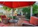 Cozy covered patio area with outdoor furniture, ideal for enjoying the backyard view at 742 Mockingbird Ln, Brighton, CO 80601