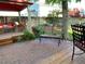 Backyard patio featuring ample seating, a wooden deck, and a well-manicured garden at 742 Mockingbird Ln, Brighton, CO 80601