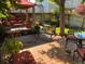 Backyard patio featuring ample seating, a wooden deck, and a well-manicured garden at 742 Mockingbird Ln, Brighton, CO 80601