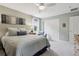 Bedroom featuring a queen bed, ceiling fan, and ample closet space at 742 Mockingbird Ln, Brighton, CO 80601