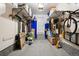 Well-organized garage with storage racks and overhead lighting at 742 Mockingbird Ln, Brighton, CO 80601