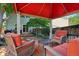 Relaxing outdoor gazebo with wicker furniture on the deck, surrounded by a privacy fence at 742 Mockingbird Ln, Brighton, CO 80601