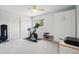 Bright home gym with exercise bike, free weights and plenty of storage at 742 Mockingbird Ln, Brighton, CO 80601