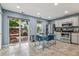 Bright kitchen with stainless steel appliances, gray cabinets, and a glass door to an inviting backyard patio at 742 Mockingbird Ln, Brighton, CO 80601