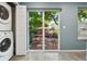 Kitchen features a view into the backyard, deck, and patio furniture through sliding glass doors at 742 Mockingbird Ln, Brighton, CO 80601