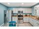 Bright kitchen featuring granite countertops, stainless steel appliances and light, neutral cabinets at 742 Mockingbird Ln, Brighton, CO 80601