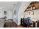 Unique workspace showcasing a desk area with stylish shelving and hardwood floors at 742 Mockingbird Ln, Brighton, CO 80601