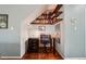 Cozy office space under stairs with built-in shelving and a functional desk area at 742 Mockingbird Ln, Brighton, CO 80601