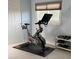 Workout room featuring an exercise bike, weights, carpeted floors, and a bright window at 742 Mockingbird Ln, Brighton, CO 80601