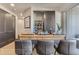 Stylish bar area with a sleek countertop, comfortable seating, and modern design elements at 1768 Peak Loop, Broomfield, CO 80023