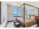 Stylish bedroom featuring a four-poster bed and contemporary decor at 1768 Peak Loop, Broomfield, CO 80023