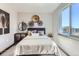 Comfortable bedroom featuring modern decor and a large window at 1768 Peak Loop, Broomfield, CO 80023