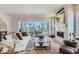 Spacious living room with a modern fireplace, comfortable seating, and sliding glass doors to a relaxing outdoor balcony at 1768 Peak Loop, Broomfield, CO 80023