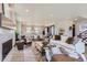 Expansive living area showcases an open-concept design that integrates seamlessly with the kitchen and dining spaces at 1768 Peak Loop, Broomfield, CO 80023
