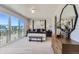Stylish main bedroom featuring a large window, contemporary decor, and comfortable furnishings at 1768 Peak Loop, Broomfield, CO 80023