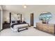Stylish main bedroom featuring a large window, contemporary decor, and comfortable furnishings at 1768 Peak Loop, Broomfield, CO 80023