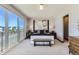Stylish main bedroom featuring a large window, contemporary decor, and comfortable furnishings at 1768 Peak Loop, Broomfield, CO 80023