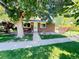 Charming single-story brick home with mature tree in front yard and cozy porch area at 9255 E Lehigh # 213, Denver, CO 80237