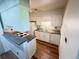 Functional kitchen featuring white cabinets, laminate countertops, and essential appliances at 9255 E Lehigh # 213, Denver, CO 80237