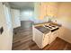 Efficient kitchen with modern flooring, countertop breakfast bar, and bright, airy ambiance at 9255 E Lehigh # 213, Denver, CO 80237