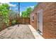 Backyard with gravel ground cover, white painted door and brick building at 2738 W 38Th Ave, Denver, CO 80211
