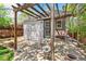 Outdoor space with stone patio, pergola, and landscaped yard at 2738 W 38Th Ave, Denver, CO 80211