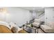 Finished basement showcasing stylish seating, a coffee table, and unique flooring at 2738 W 38Th Ave, Denver, CO 80211
