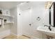 Well-lit bathroom featuring a pedestal sink, modern fixtures, and neutral decor at 2738 W 38Th Ave, Denver, CO 80211
