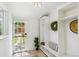 Inviting entryway with built-in storage, tile flooring, and a view of the outdoor area at 2738 W 38Th Ave, Denver, CO 80211