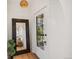 Bright entryway with hardwood floors, decorative front door, and a large mirror at 2738 W 38Th Ave, Denver, CO 80211