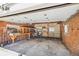 Spacious garage with brick walls, work benches, and ample storage space, perfect for DIY projects and organization at 2738 W 38Th Ave, Denver, CO 80211