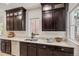 Kitchen featuring dark cabinets, stainless steel appliances, and stone tile flooring at 2738 W 38Th Ave, Denver, CO 80211